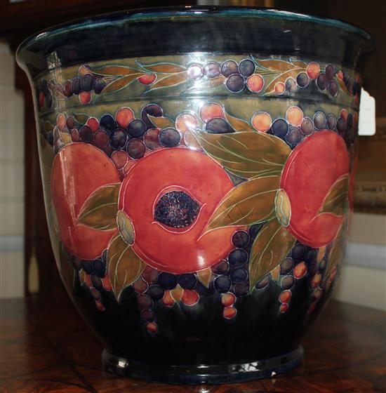 A large William Moorcroft pomegranate pattern jardiniere, dated 1919, 31.5 x 36cm, damage